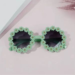 Kid Teal & Black Round Flower Sunglasses
NWT
Make An Offer!
